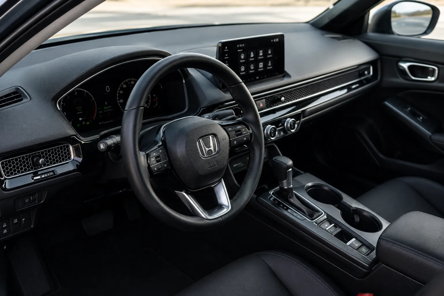 Honda interior with a digital dashboard, touchscreen display, and steering wheel, showcasing the quality and reliability supported by professional Honda service & maintenance.
