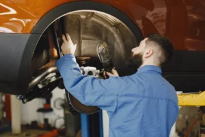 Professional mechanic repairing car at a vehicle repair shop in Dubai