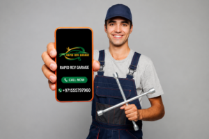 Mobile mechanic holding a smartphone displaying Rapid Rev Garage contact details, offering convenient on-site vehicle repair and maintenance services for customers.