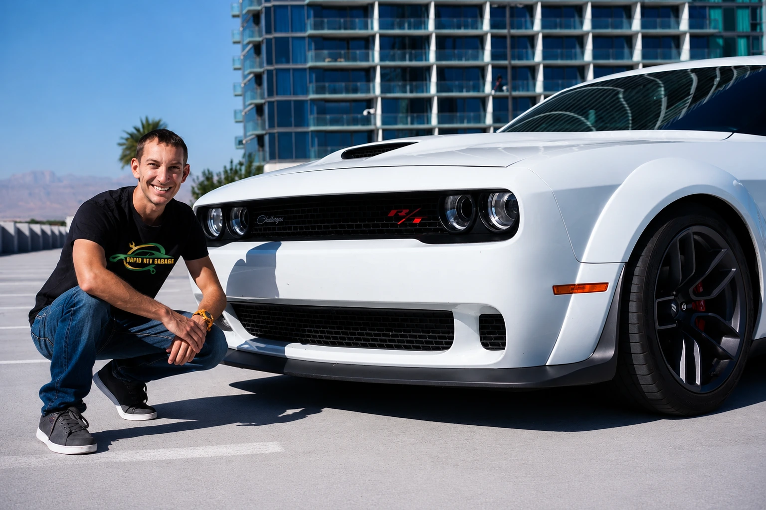 Rapid Rev Garage mechanic beside a white Dodge Challenger, inspecting the vehicle while highlighting common Problems with Dodge Challenger in a professional automotive service setting.